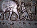 British Museum Top 20 14-2 Black Obelisk Close Up 14. Black obelisk of Shalmaneser III, 825BC, Nimrod (northern Iraq), 198cm high. Here is a close up of the third panel showing the tribute of the country of Musri (probably Egypt), consisting entirely of animals led or driven by attendants dressed in knee-length garments.